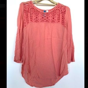 Francesca’s “Buttons” brand top.